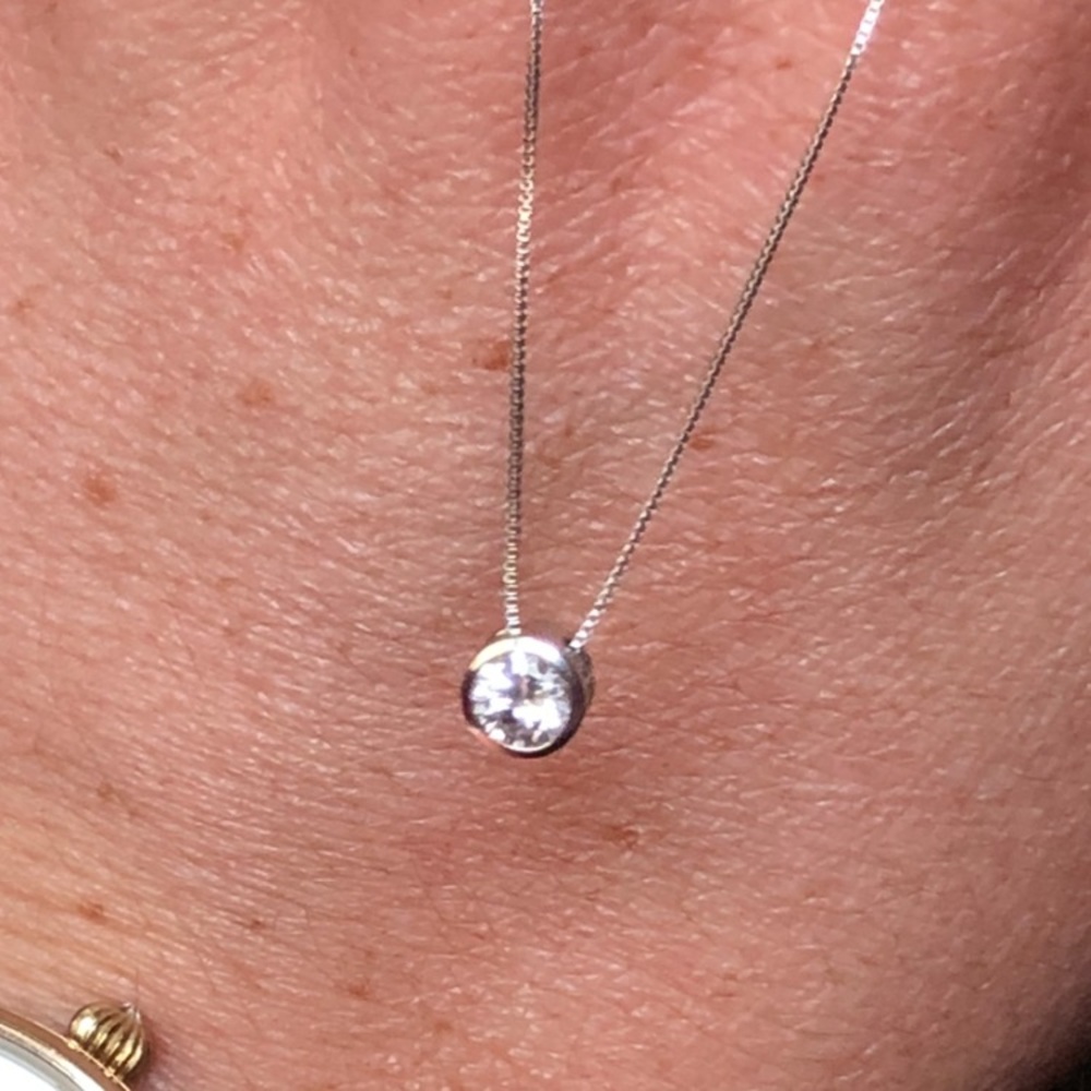 A beautiful solid white gold 1/3 cttw diamond solitaire pendant. SUPER sparkly!